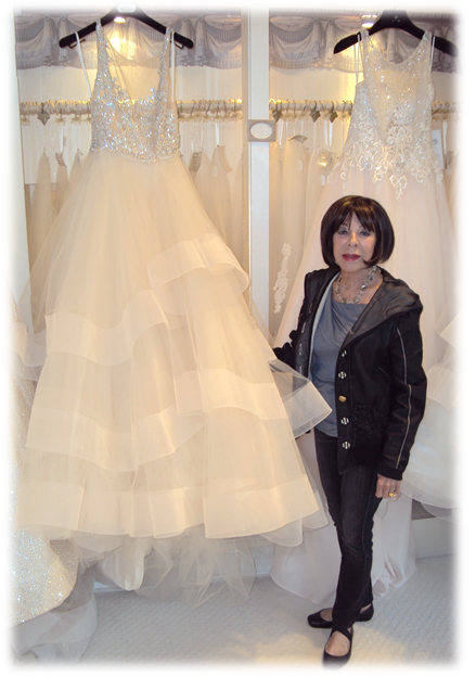 Owner of Elizabeth's Bridal Manor with wedding dress - - Photo by Detroit Wedding Day