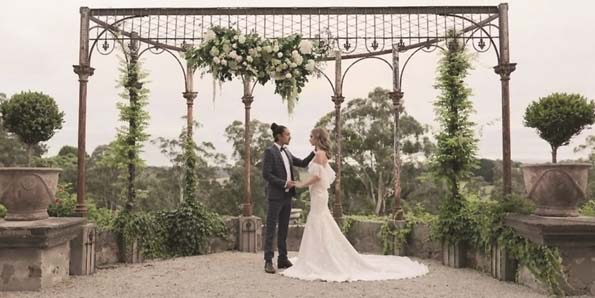 couple under arch Photo credit Sephory Photography