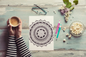 Flat lay, female coloring adult coloring books, new stress relieving trend