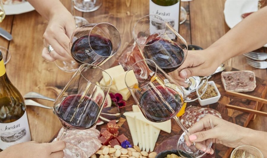 wine glasses with cheese and meats