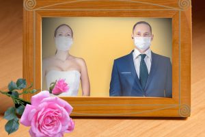 photo frame with wedding couple with masks