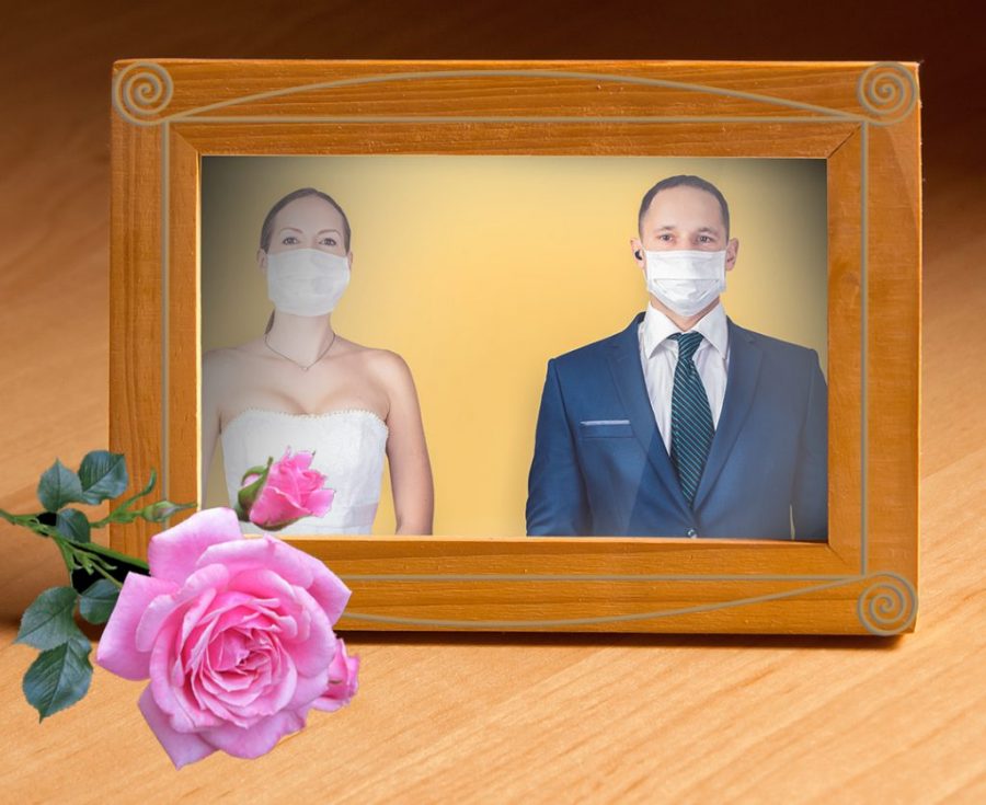 photo frame with wedding couple with masks