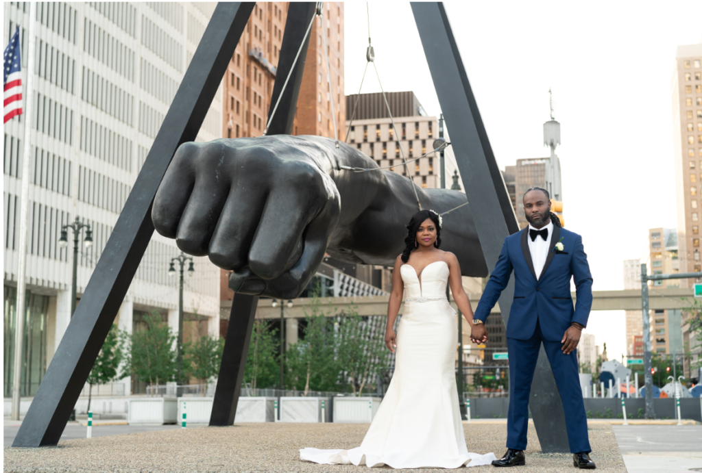 Photo of wedding couple in Detroit with Joe Lewis fist. #stopinthenameofblacklove