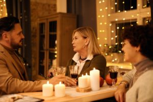 Group of adult friends at dinner party at home