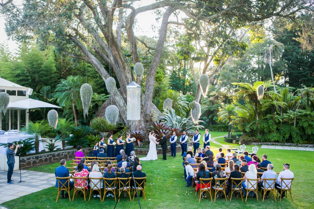 Photo of outdoor wedding ceremony with witnesses.