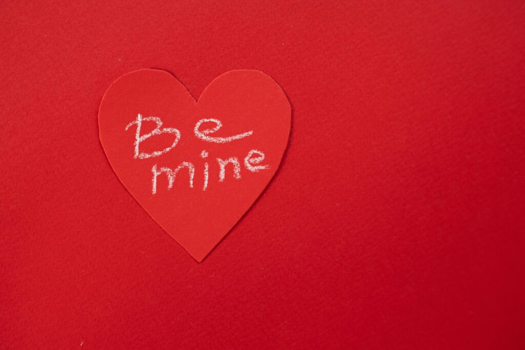 Heart Shape with Be Mine printed on card.